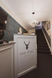 a stairway with a sign that reads the st stage at The Stag Hotel in Lyndhurst