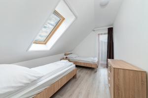Postel nebo postele na pokoji v ubytování Hérics Apartman + 31 fotografií
