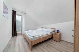 Posteľ alebo postele v izbe v ubytovaní Hérics Apartman