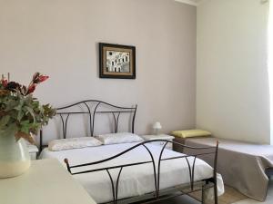 Postel nebo postele na pokoji v ubytování La casa spaziosa sui Sassi