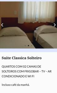 Een bed of bedden in een kamer bij Novo Grande Hotel