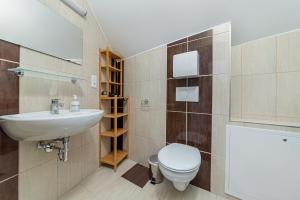 Kúpeľňa v ubytovaní Hérics Apartman