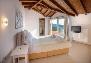 A bed or beds in a room at Spacious House with extraordinary view in Corfu