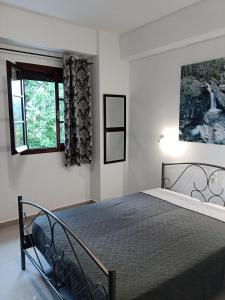 Tempat tidur dalam kamar di Karidia Apartments