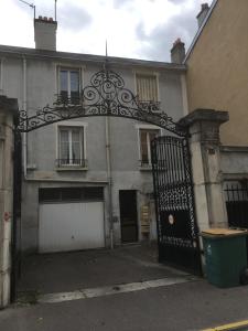 an old building with a gate in front of it at Le Campus Victoria I - Train Station & Isabey St - 70m2 in Nancy
