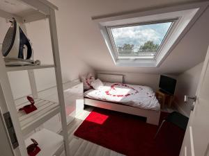Cama ou camas em um quarto em Ferienwohnung Schlüter Nußloch