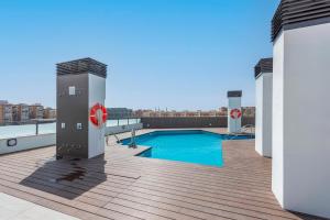 The swimming pool at or close to Modern apartment next to train/bus station