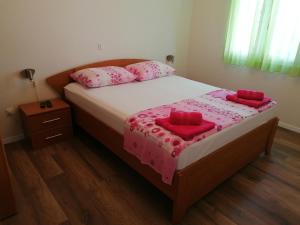 Postel nebo postele na pokoji v ubytování Apartment Poldrugo