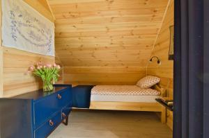 Кровать или кровати в номере Domek w Biebrzańskim Eldorado