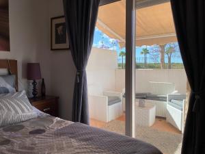 Katil atau katil-katil dalam bilik di Condado de Alhama JARDIN 11 SV17