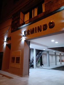 a building with a sign that reads bambino at Complejo Ermindo I in Rafaela