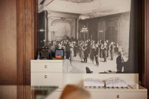a picture of a group of people dancing in a room at Hotel New York by WestCord in Rotterdam