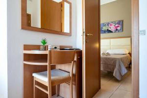 Postel nebo postele na pokoji v ubytování Amadei Hotel Figaro & Apartments