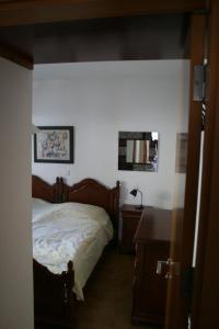 A bed or beds in a room at Los Arbustos