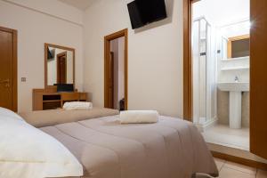 Postel nebo postele na pokoji v ubytování Amadei Hotel Figaro & Apartments