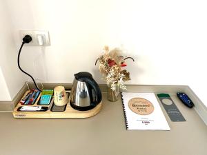Příslušenství pro přípravu čaje a kávy v ubytování Hotel Belvedere