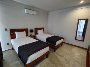 Postel nebo postele na pokoji v ubytování Hotel Muyu Tulum