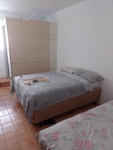 Postel nebo postele na pokoji v ubytování Pousada bandeirantes