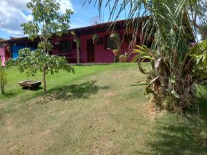 a house with a yard in front of it at Guest House Recanto da Mata - BONITO - MS in Bonito