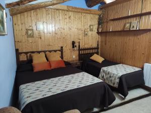 Postel nebo postele na pokoji v ubytování Casa Rural Conesa I