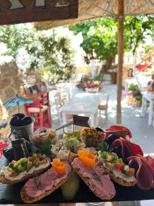 a table with a bunch of food on top at Attiki Hotel in Rhodes Town