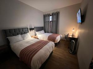 Postel nebo postele na pokoji v ubytování Casona Plaza Hotel Cusco