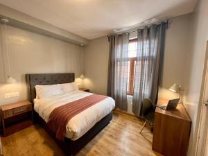 Postel nebo postele na pokoji v ubytování Casona Plaza Hotel Cusco