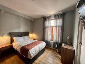 Postel nebo postele na pokoji v ubytování Casona Plaza Hotel Cusco