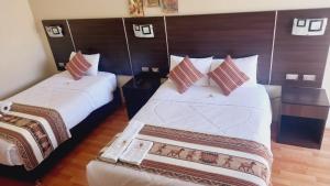 Hotel Mantas Cusco客房内的一张或多张床位