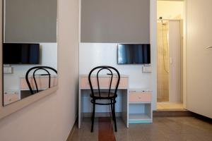 TV a/nebo společenská místnost v ubytování Amadei Hotel Blumen