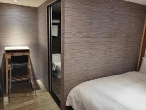 A bed or beds in a room at The Cole Hotel