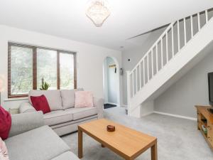 a living room with a couch and a table at 16 Mythern Meadow in Bradford on Avon
