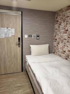 A bed or beds in a room at The Cole Hotel