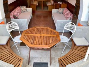 a table and two chairs and a table and chairs at AQUAMAR - Suite on the beach in Venice-Lido