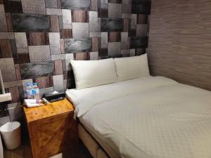 A bed or beds in a room at The Cole Hotel
