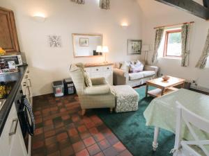 a living room with a couch and a table at Glaisdale in Whitby