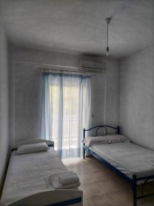 Ένα ή περισσότερα κρεβάτια σε δωμάτιο στο Mare - Rooms