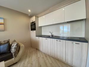 A kitchen or kitchenette at PARADISO 'В' 102 PRIVATE SEA VIEW Apartment