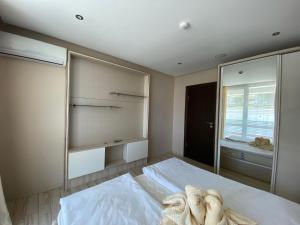 A bed or beds in a room at PARADISO 'В' 102 PRIVATE SEA VIEW Apartment