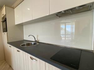 A kitchen or kitchenette at PARADISO 'В' 102 PRIVATE SEA VIEW Apartment