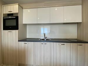 A kitchen or kitchenette at PARADISO 'В' 102 PRIVATE SEA VIEW Apartment