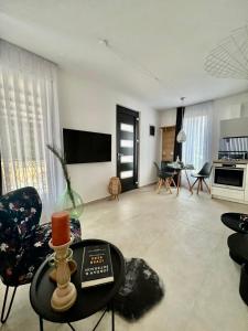 TV a/nebo společenská místnost v ubytování Apartmani CUBE L