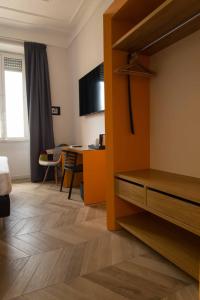 TV a/nebo společenská místnost v ubytování Terrazza Giuliana Rooftop