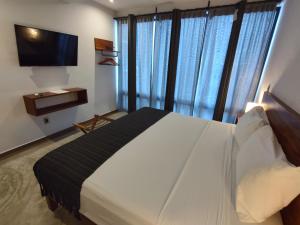 Postel nebo postele na pokoji v ubytování Hotel Muyu Tulum