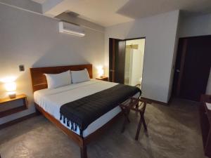 Postel nebo postele na pokoji v ubytování Hotel Muyu Tulum