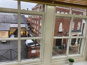 a view of a city from a window at Stylish -2 Bed -Heart of the City - Parking- Wi-fi- Award Winning- Grade II Listed in Norwich