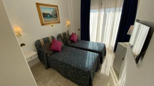 Posezení v ubytování Capri Bougainville Luxury Boutique Hotel