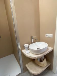 a bathroom with a sink and a shower at La casa sull’acqua in Olbia +31 photos