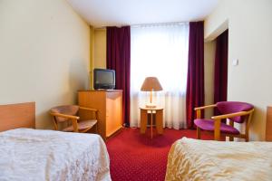 Posteľ alebo postele v izbe v ubytovaní Hostel Malinowski City
