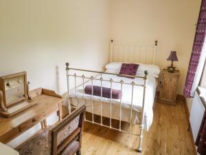 Postel nebo postele na pokoji v ubytování Howley Cottage